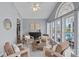 Bright sunroom features contemporary decor, comfortable seating, and natural light at 156 Pecan Hills Dr, Mooresville, NC 28115