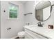 Bathroom features modern fixtures, a white vanity, round mirror, and natural light at 1640 English Knoll Dr, Matthews, NC 28105