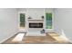Modern fireplace with shiplap and decor in a naturally lit living space at 1640 English Knoll Dr, Matthews, NC 28105