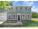 Charming two-story home with gray siding, white trim, and well-maintained landscaping at 1640 English Knoll Dr, Matthews, NC 28105