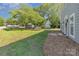 A well-manicured lawn and a home with beautiful curb appeal create a welcoming entrance at 1640 English Knoll Dr, Matthews, NC 28105