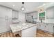 Open kitchen featuring gray cabinets, stainless appliances, and granite counters at 1640 English Knoll Dr, Matthews, NC 28105