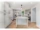 Bright updated kitchen with island, granite counters and stainless appliances at 1640 English Knoll Dr, Matthews, NC 28105