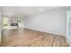 Bright living room with wood flooring, an electric fireplace, and recessed lighting at 1640 English Knoll Dr, Matthews, NC 28105
