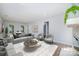 Cozy living room featuring a comfortable seating area and view into the dining area and natural light at 1640 English Knoll Dr, Matthews, NC 28105