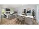 Open-concept living space with a fireplace, dining area, and stylish decor for modern living at 1640 English Knoll Dr, Matthews, NC 28105