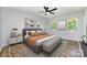 Comfortable main bedroom with a plush bed, stylish decor, and abundant natural light from the windows at 1640 English Knoll Dr, Matthews, NC 28105