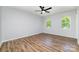 Large main bedroom with ceiling fan, windows and a bathroom entrance at 1640 English Knoll Dr, Matthews, NC 28105