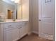 Bright bathroom with a single sink vanity, a neutral color palette, and plenty of storage space at 16711 Monocacy Blvd, Huntersville, NC 28078