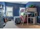 bedroom features a unique bunk bed with integrated desk, blue walls, and bright natural light at 16711 Monocacy Blvd, Huntersville, NC 28078