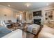 Comfortable living room features a fireplace, built-in shelving, and ample seating space at 16711 Monocacy Blvd, Huntersville, NC 28078