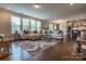 Bright and airy living room with large windows offering lots of natural light, kitchen and dining area visible at 16711 Monocacy Blvd, Huntersville, NC 28078