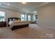 Large main bedroom has bright natural light and sitting area with two chairs at 16711 Monocacy Blvd, Huntersville, NC 28078