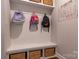 Convenient mudroom features built-in storage with hooks, bench, and baskets for organization at 16711 Monocacy Blvd, Huntersville, NC 28078