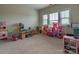 Bright playroom filled with toys and natural light from the large window at 16711 Monocacy Blvd, Huntersville, NC 28078