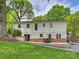 Backyard with a patio, outdoor seating, and a well-maintained lawn at 1733 Piccadilly Dr, Charlotte, NC 28211