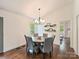 Elegant dining area with modern lighting and a round table with comfortable seating at 1733 Piccadilly Dr, Charlotte, NC 28211
