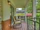 Cozy front porch featuring comfortable seating with views of the landscaped yard at 1733 Piccadilly Dr, Charlotte, NC 28211