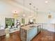 Open-concept living area with large island and hardwood floors, perfect for modern living at 1733 Piccadilly Dr, Charlotte, NC 28211