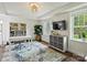 Bright home office with large windows, a modern desk, and built-in bookshelves at 1733 Piccadilly Dr, Charlotte, NC 28211
