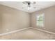 Neutral bedroom featuring a ceiling fan, neutral walls, and carpet flooring at 1737 Cavaillon Dr, Waxhaw, NC 28173