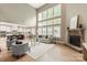 Bright living room boasting a fireplace, seamless kitchen access, and an abundance of natural light at 1737 Cavaillon Dr, Waxhaw, NC 28173