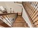Staircase with wood stairs, metal spindles and wood railing at 1737 Cavaillon Dr, Waxhaw, NC 28173