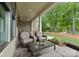 Relaxing outdoor living space with comfortable seating, a ceiling fan, and a view of the lush backyard at 20614 Pointe Regatta Dr, Cornelius, NC 28031