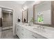 Modern bathroom with double vanity, quartz countertops, and tile flooring at 20614 Pointe Regatta Dr, Cornelius, NC 28031
