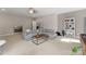 Large living room with a gray sectional couch, neutral carpet, and a bright interior at 20614 Pointe Regatta Dr, Cornelius, NC 28031