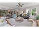 Bright and airy living room with an open layout, neutral decor, and a view to the dining area at 20614 Pointe Regatta Dr, Cornelius, NC 28031