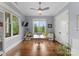 Well-lit home office with hardwood floors, multiple windows, and ample workspace at 20614 Pointe Regatta Dr, Cornelius, NC 28031