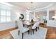 Bright dining room with a view into the adjacent living room at 216 Liriope Ct, Matthews, NC 28105