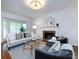 Cozy living room featuring a fireplace and neutral decor at 216 Liriope Ct, Matthews, NC 28105