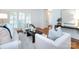 Cozy living room featuring bright light, hardwood floors, and modern furniture at 216 Liriope Ct, Matthews, NC 28105