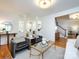 Bright living room with open floor plan, modern decor, and hardwood flooring at 216 Liriope Ct, Matthews, NC 28105