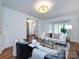 Comfortable living room featuring neutral decor and lots of natural light at 216 Liriope Ct, Matthews, NC 28105