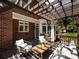 Inviting outdoor patio with stylish seating, pergola, and a charming rug for a relaxing ambiance at 216 Liriope Ct, Matthews, NC 28105
