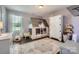 This lovely bedroom features a whimsical bunk bed, a fluffy rug and a lovely window view at 2206 Mills Harris Rd, Wingate, NC 28174