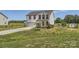 Beautiful two-story home with a well-kept lawn, gravel driveway, and welcoming front porch at 2206 Mills Harris Rd, Wingate, NC 28174