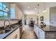 Modern kitchen featuring white cabinets, granite countertops, stainless steel appliances, and hardwood flooring at 2206 Mills Harris Rd, Wingate, NC 28174