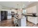 Spacious kitchen featuring stainless steel appliances, a kitchen island, and ample cabinet space at 2206 Mills Harris Rd, Wingate, NC 28174