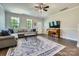 Comfortable living room featuring a large sectional sofa, area rug, and a piano for entertainment at 2206 Mills Harris Rd, Wingate, NC 28174