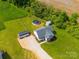 Aerial view of home with fencing, pool, sheds, landscaping, and gravel driveway at 2225 Corinth Church Rd, Monroe, NC 28112