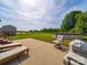 Backyard patio with lounge chairs, a barbecue and a view of the pool and shed at 2225 Corinth Church Rd, Monroe, NC 28112