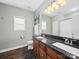 Bathroom with double vanity, granite countertop, and tiled floors at 2225 Corinth Church Rd, Monroe, NC 28112