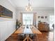 Dining room with a long wood table, stylish chairs, and a decorative chandelier for a great Gathering dining experience at 2225 Corinth Church Rd, Monroe, NC 28112