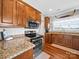 Updated kitchen with granite countertops, stainless steel appliances, and hardwood floors at 2225 Corinth Church Rd, Monroe, NC 28112