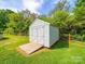 Shed with a ramp for easy access and a fence behind on a grassy lot at 2225 Corinth Church Rd, Monroe, NC 28112