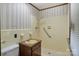 Traditional bathroom featuring a walk-in shower with safety bars and a quaint, laminate countertop vanity at 237 Fea Ln, Iron Station, NC 28080